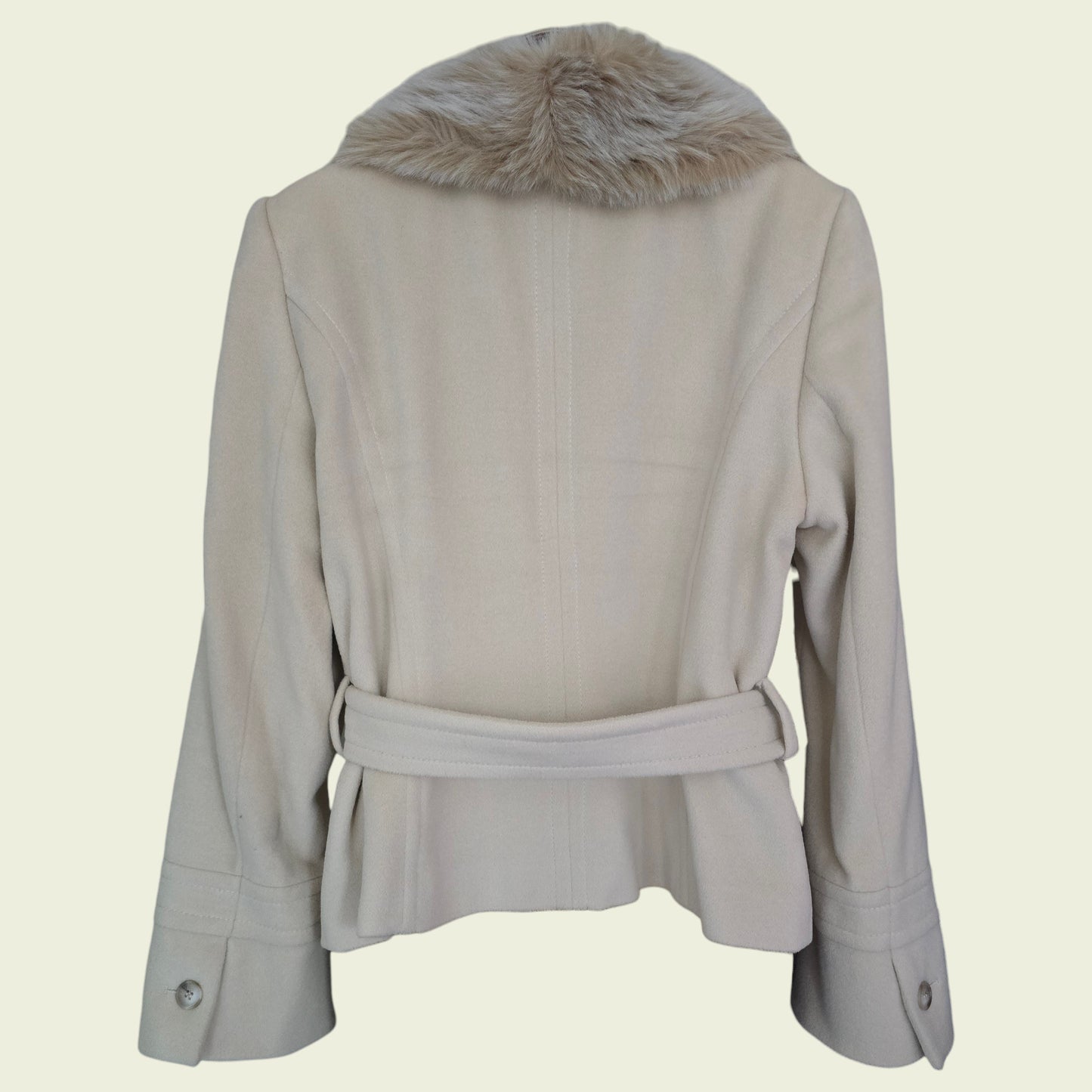 Beige jacket with fur collar on a beige background
