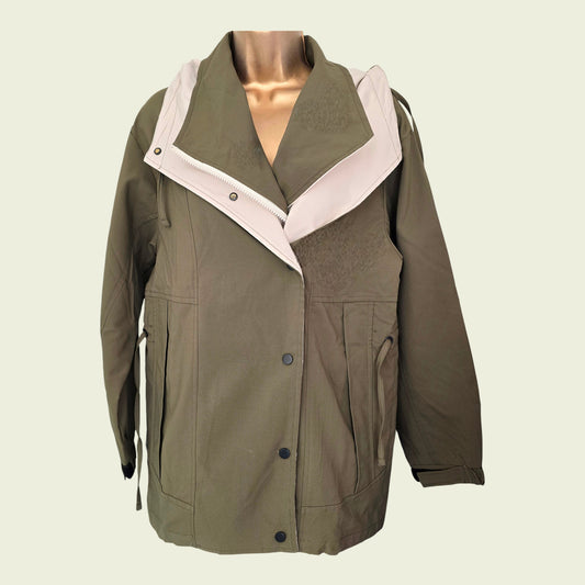 Khaki rain coat on beige background