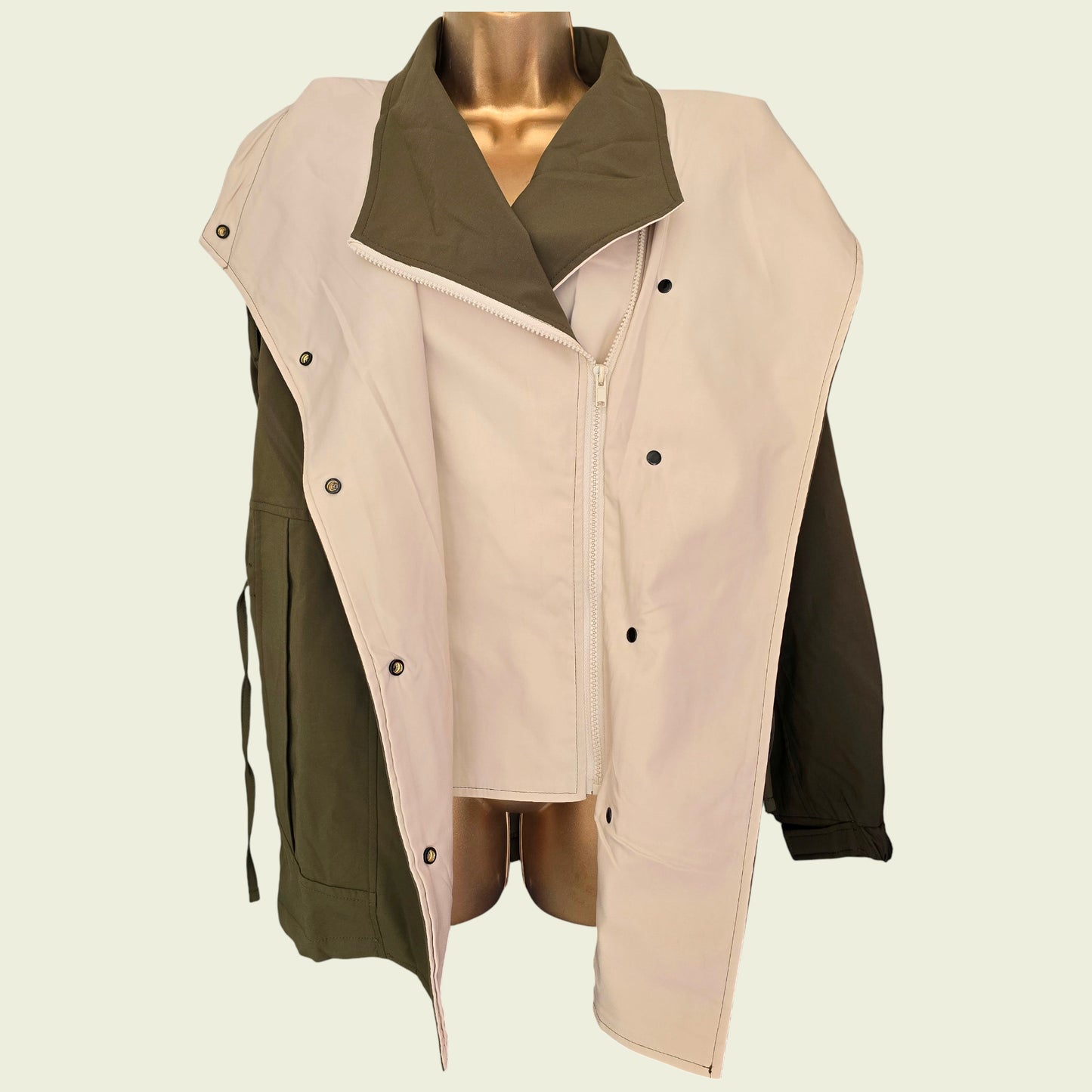 Khaki rain coat showing internal jacket on beige background