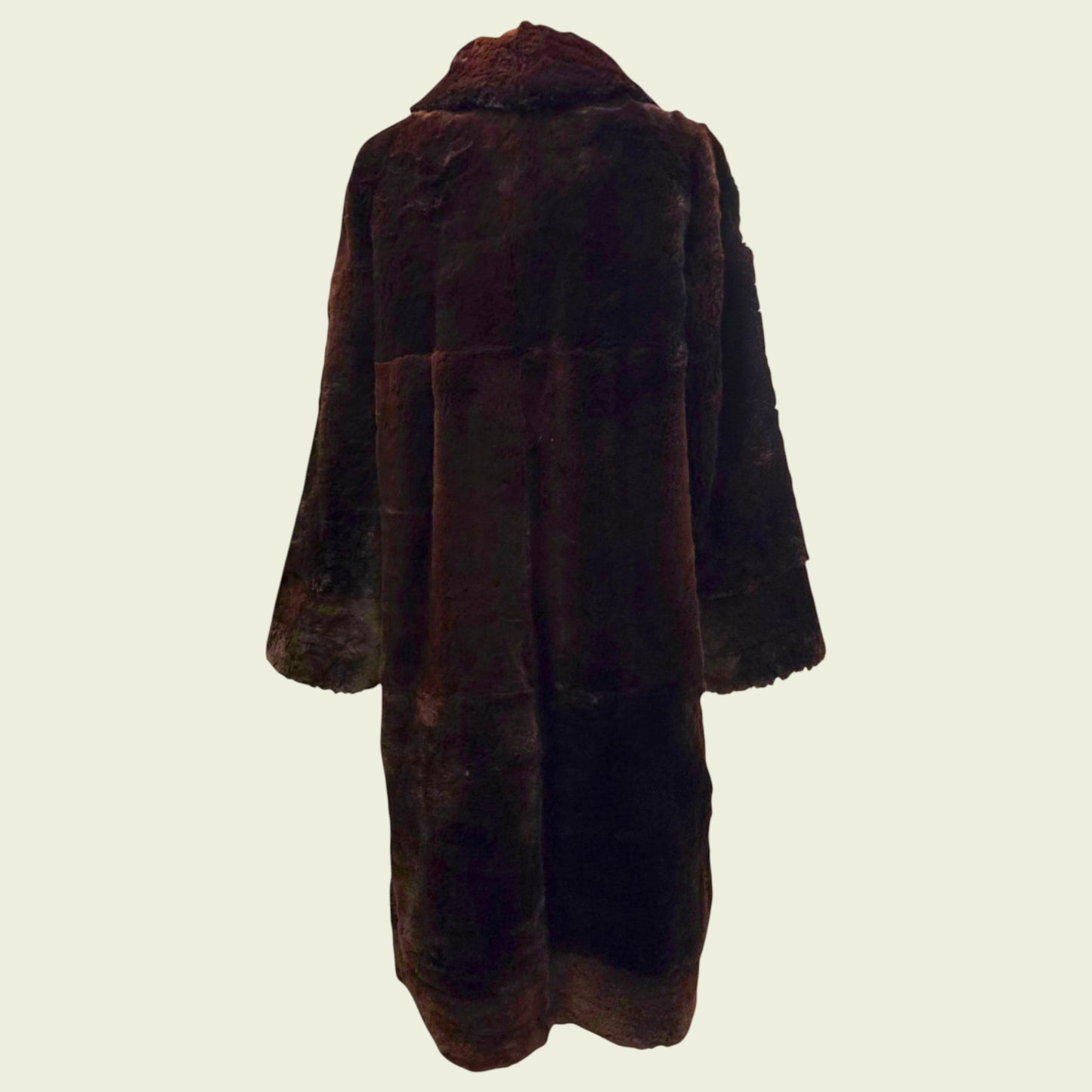Brown fur coat on a beige background