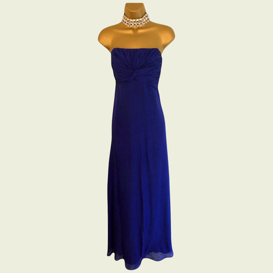 Blue strapless gown on a mannequin with a beige background