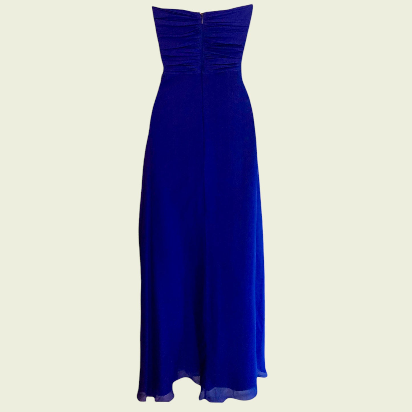 Blue strapless gown on a beige background