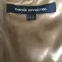 Beige fabric swatch with 'French Connection' branding