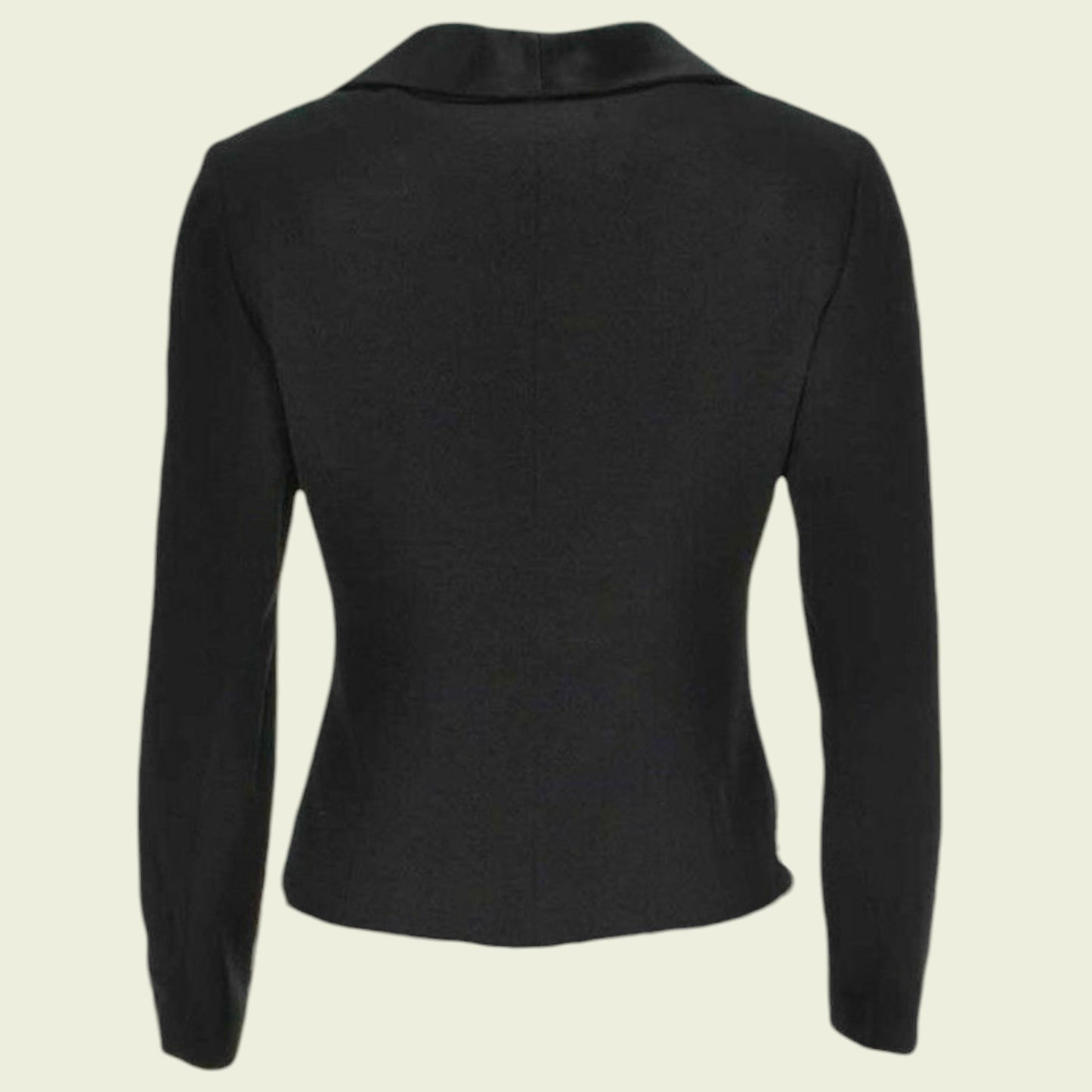 Black long-sleeve top on a beige background