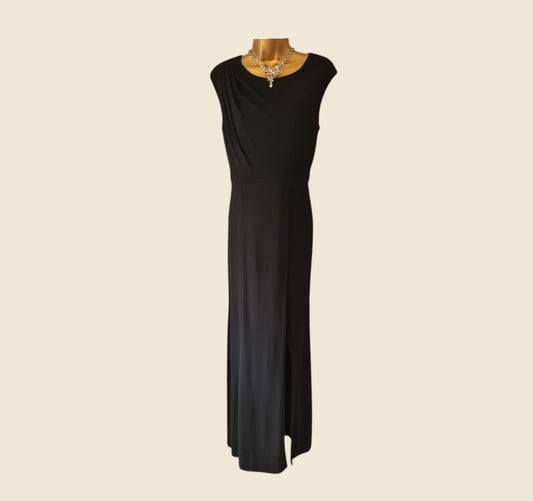 Black evening gown on a mannequin against a beige background