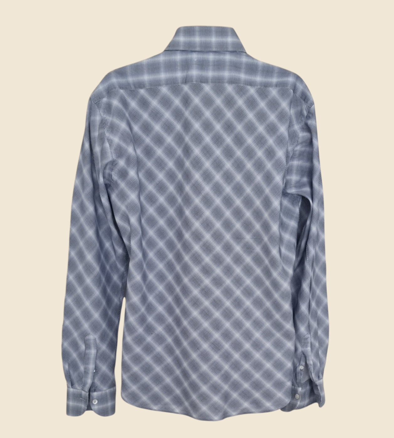 Blue checkered shirt on a beige background