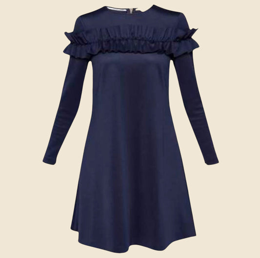 Navy blue dress with ruffled sleeves on a beige background