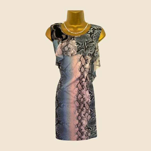 Mannequin wearing a patterned dress with a neutral background