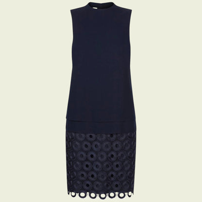 Navy blue dress with lace detailing on a beige background