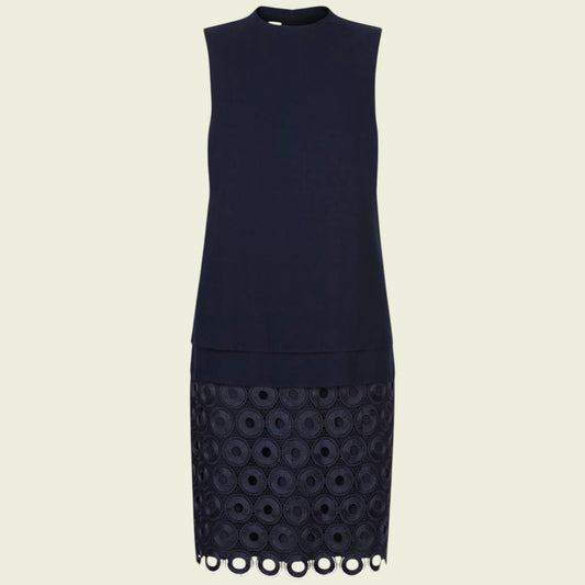 Navy blue dress with lace detailing on a beige background