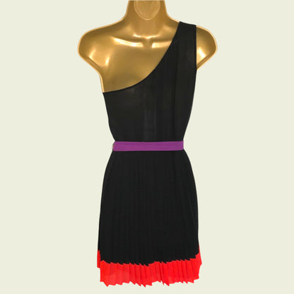 Black dress with a purple belt and red hem on a mannequin against a beige background
