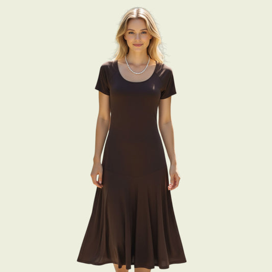 Woman wearing a brown dress on a beige background