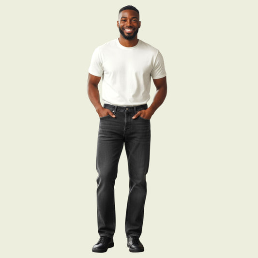 Man wearing a white t-shirt and black jeans on a beige background