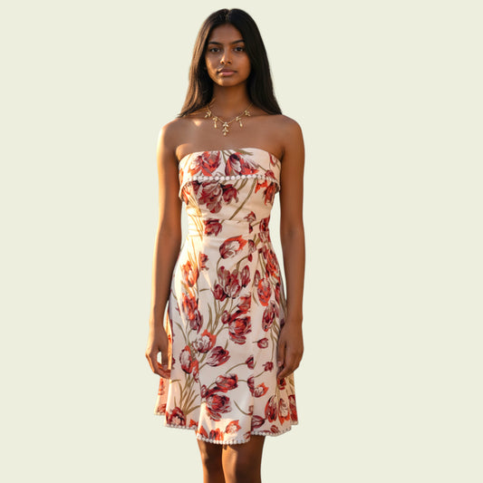 Model wearing a floral bardot top dress on beige background