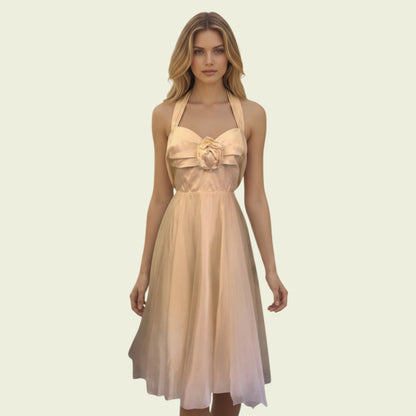 Model wearing cream organza prom dress on beige background