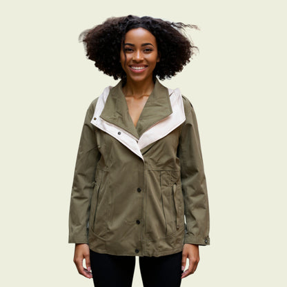 Model wearing khaki rain coat on beige background