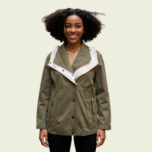 Model wearing khaki rain coat on beige background
