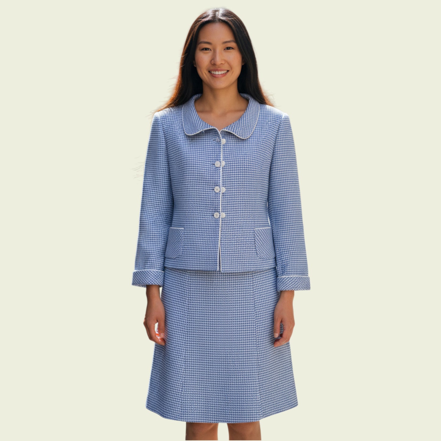 Model wearing blue checkered suit on a mannequin against a beige background