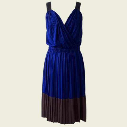 Blue and brown dress on a beige background