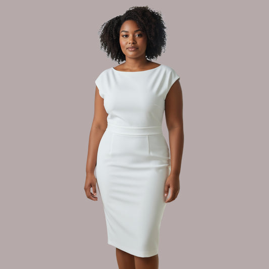 Woman wearing a white dress against a plain background