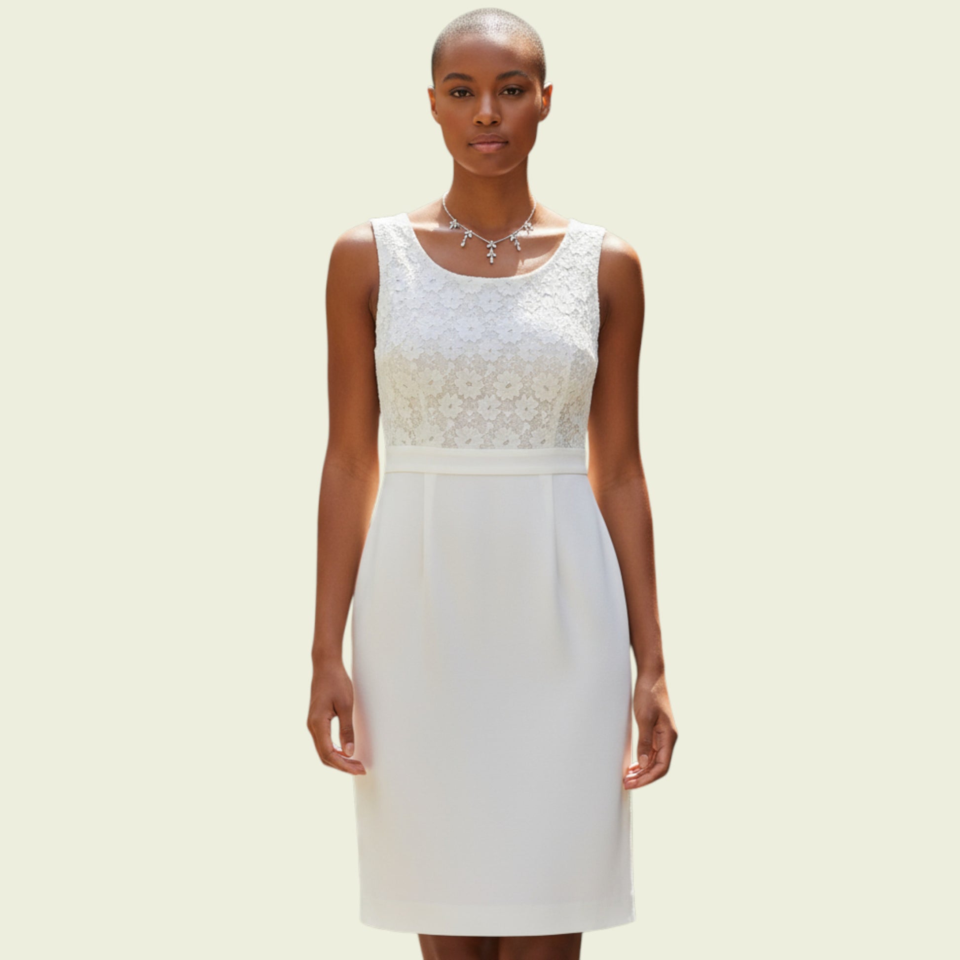 Model wearing a cream dress on beige background