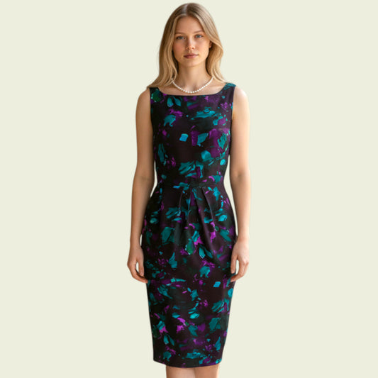 Model wearing Black purple and turquoise pencil dress on a beige background