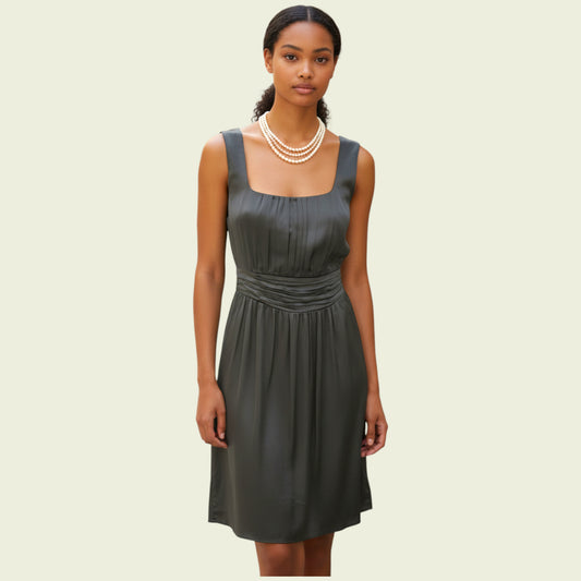 Model wearing brown A Line dress on beige background
