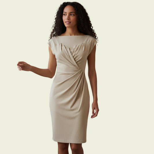 Woman wearing a beige dress on a plain background