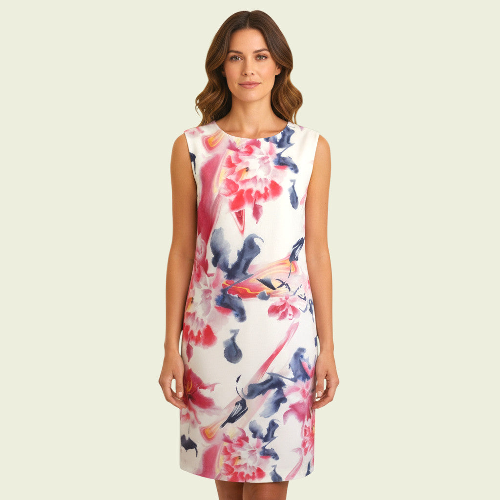 Model wearing white and multicoloured floral dress on beige background