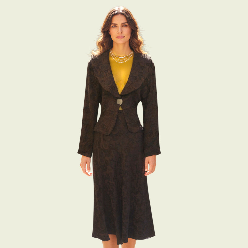 Woman wearing a brown suit with a yellow top on a light beige background