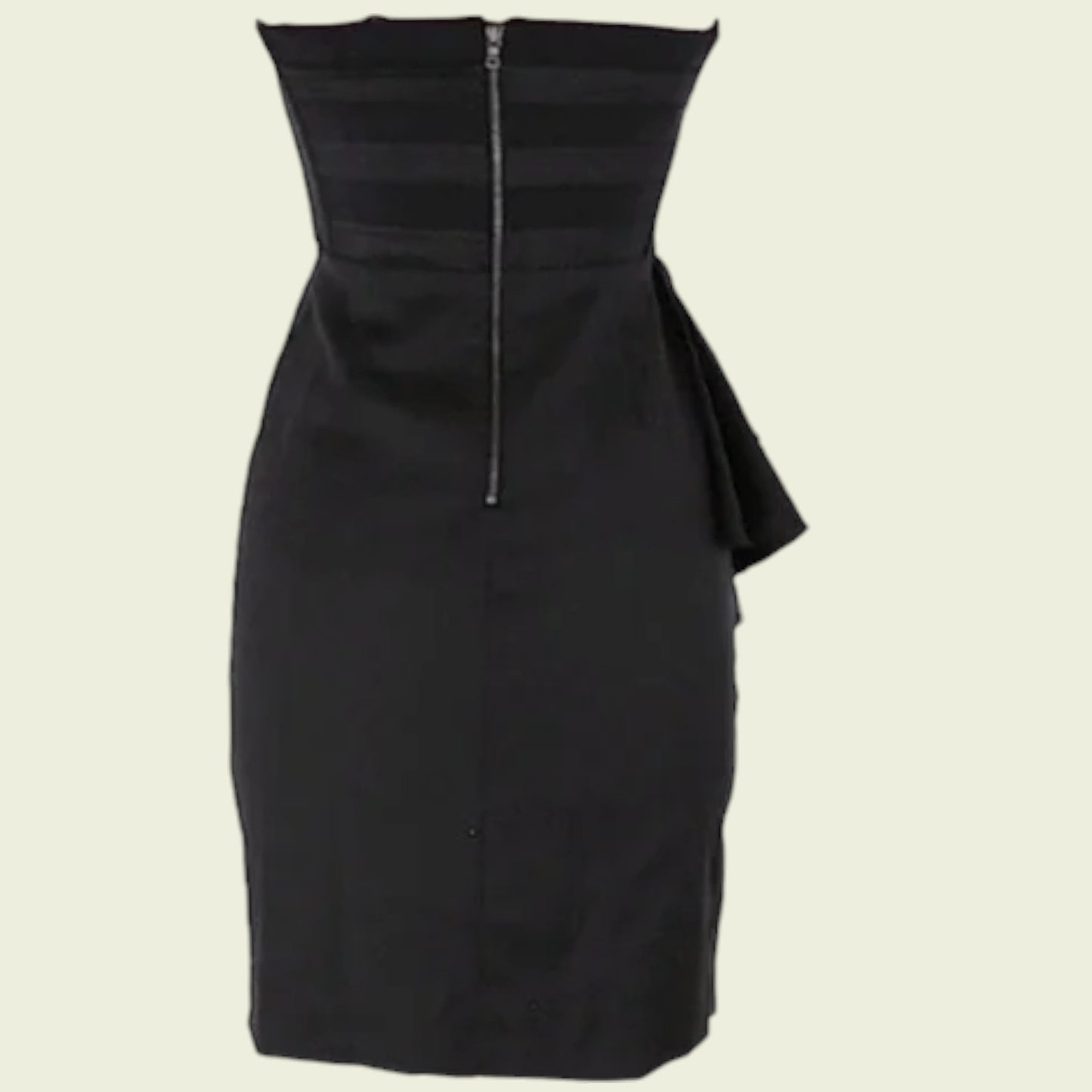 Black dress with a unique design on a beige background