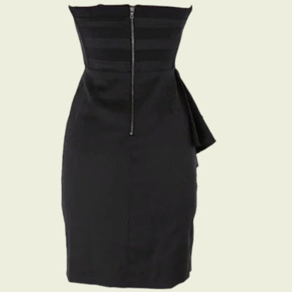 Black dress with a unique design on a beige background