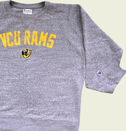 Gray sweatshirt with 'VCU Rams' text and logo on a light green background
