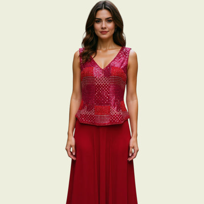 Woman wearing a red skirt with a textured top on a beige background