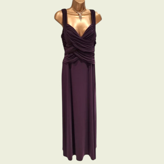 Mannequin wearing a long purple special occasions dress on a beige background