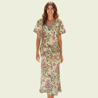 Woman wearing a floral dress on a beige background