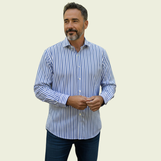Man wearing a blue and white striped shirt against a beige background