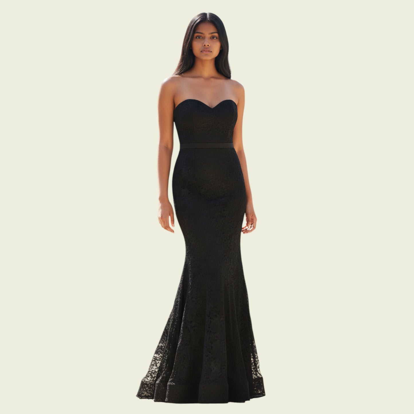 Black strapless gown on a model against a beige background