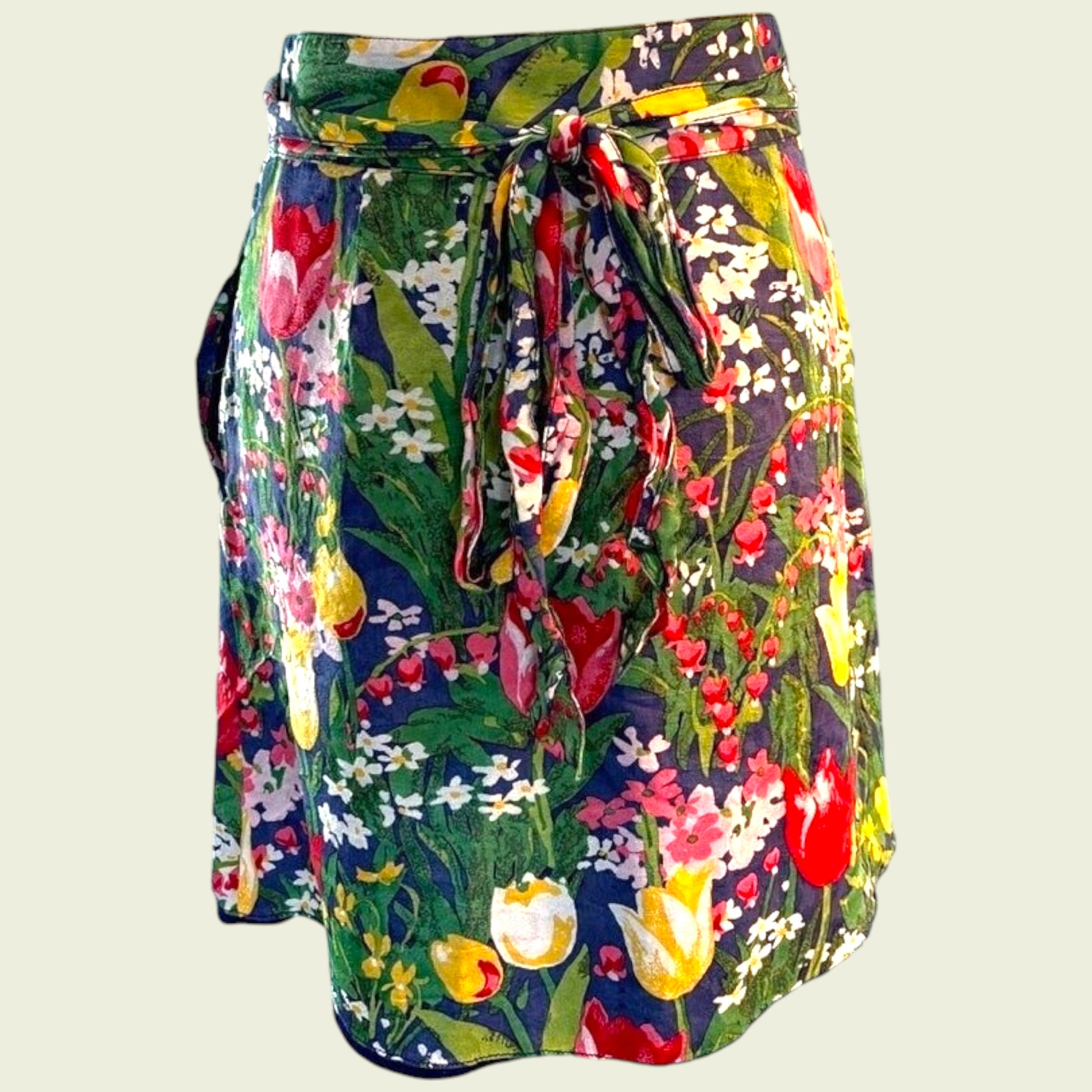 Colorful floral skirt with a tie waist on a light background