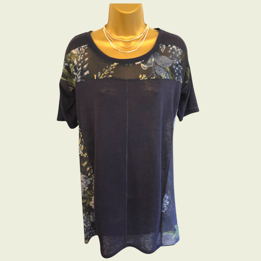 Navy blue dress with floral patterns on a mannequin against a light background