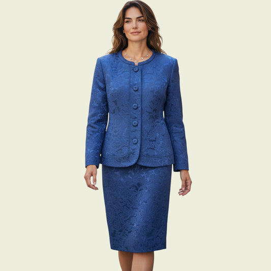 Model wearing a midnight blue dress and jacket set on a beige background