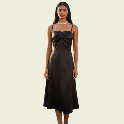 Model wearing an olive green dress on beige background