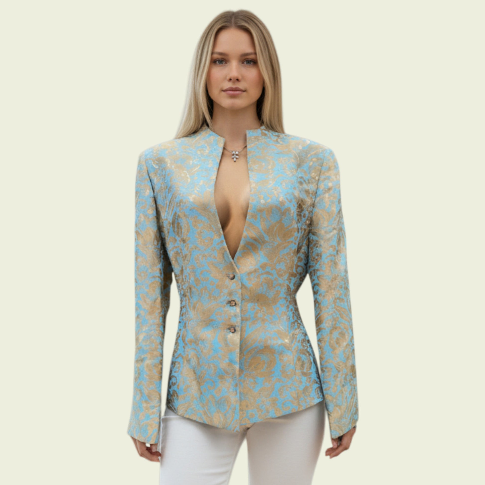 Model wearing a light blue and gold jacket on a beige background