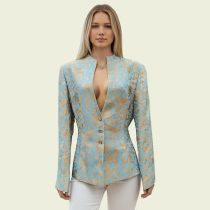 Model wearing a light blue and gold jacket on a beige background