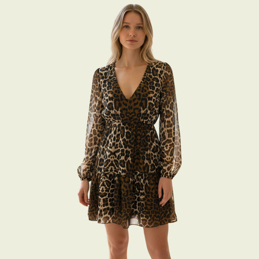 Model wearing animal print chiffon dress on beige background