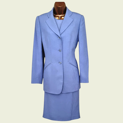 Blue suit on a mannequin against a plain background
