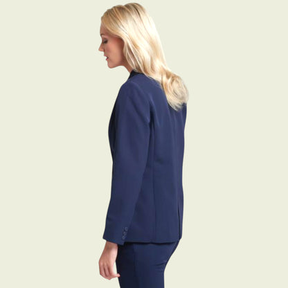 Woman wearing a blue suit on a beige background