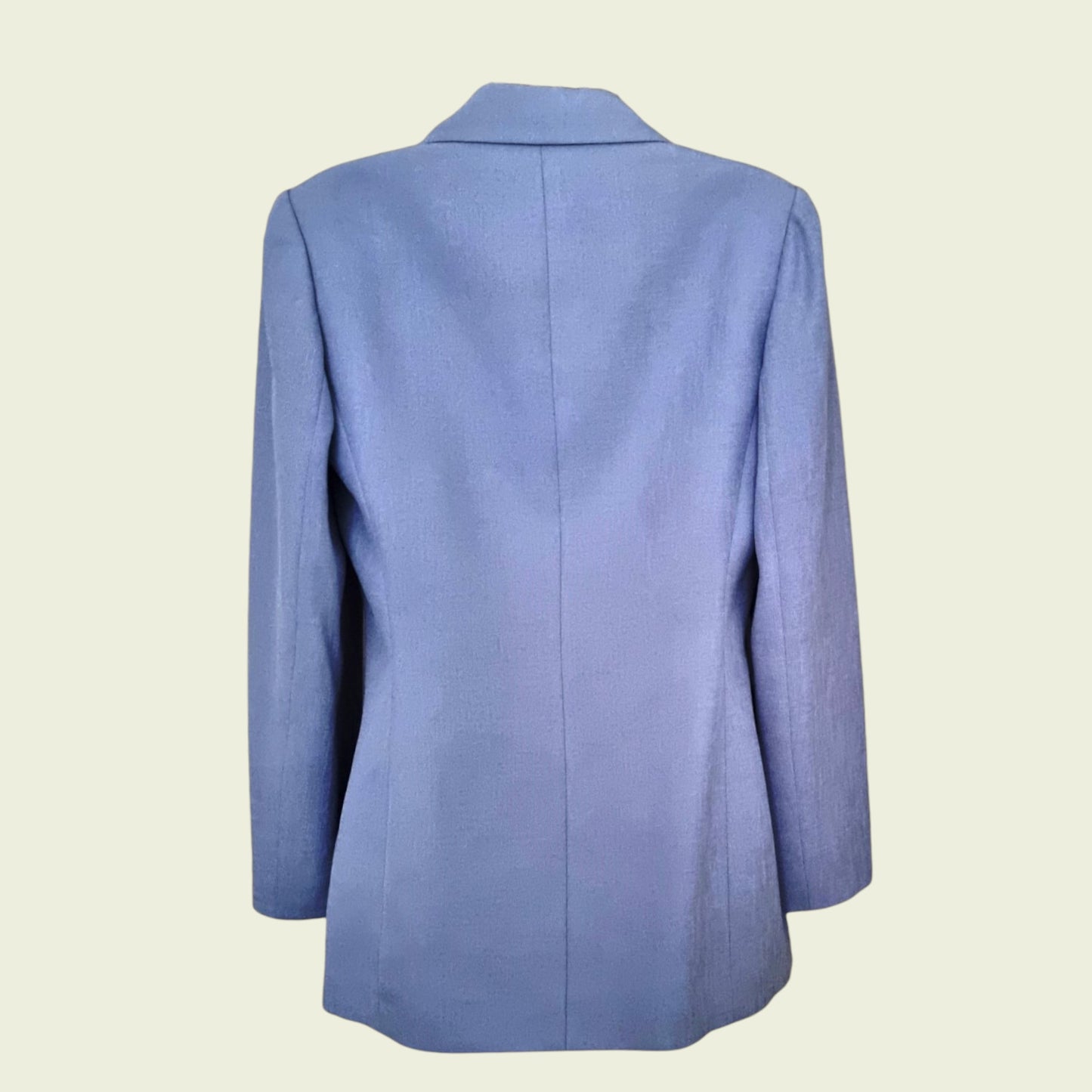 Blue blazer on a beige background