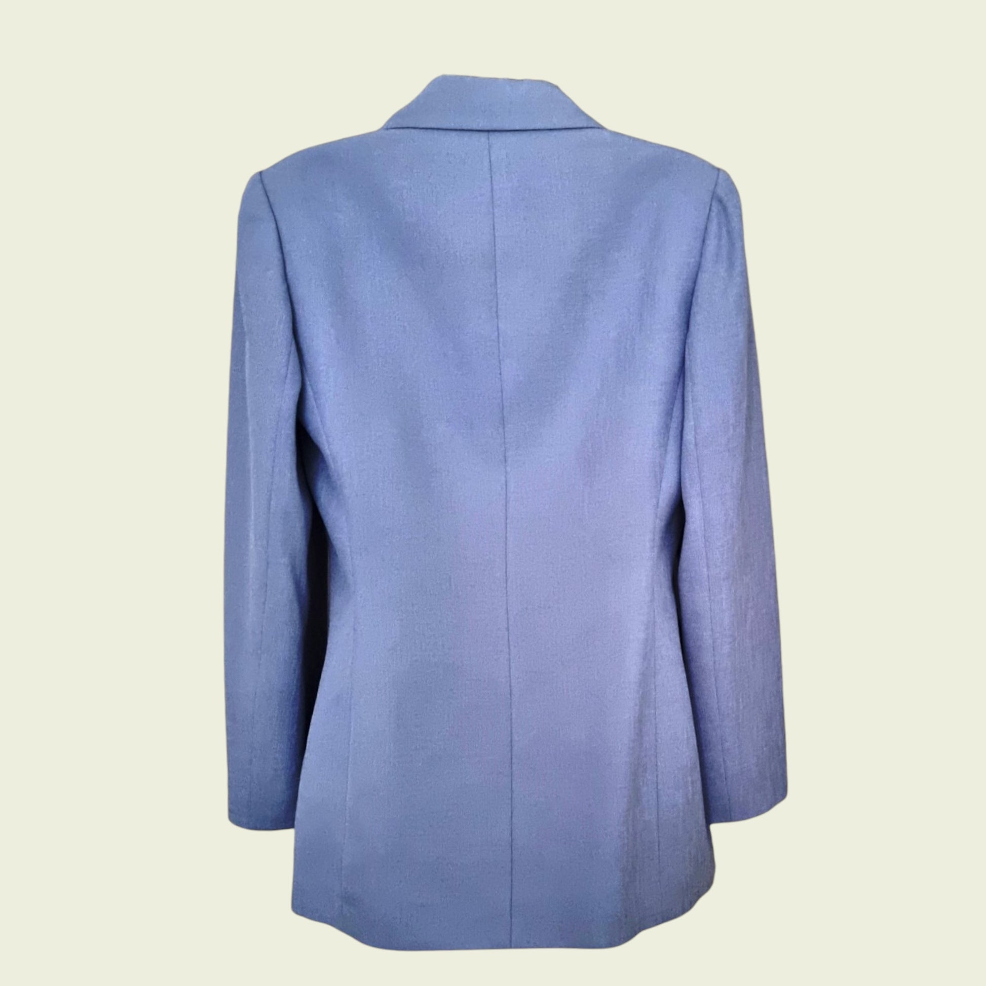 Blue blazer on a beige background