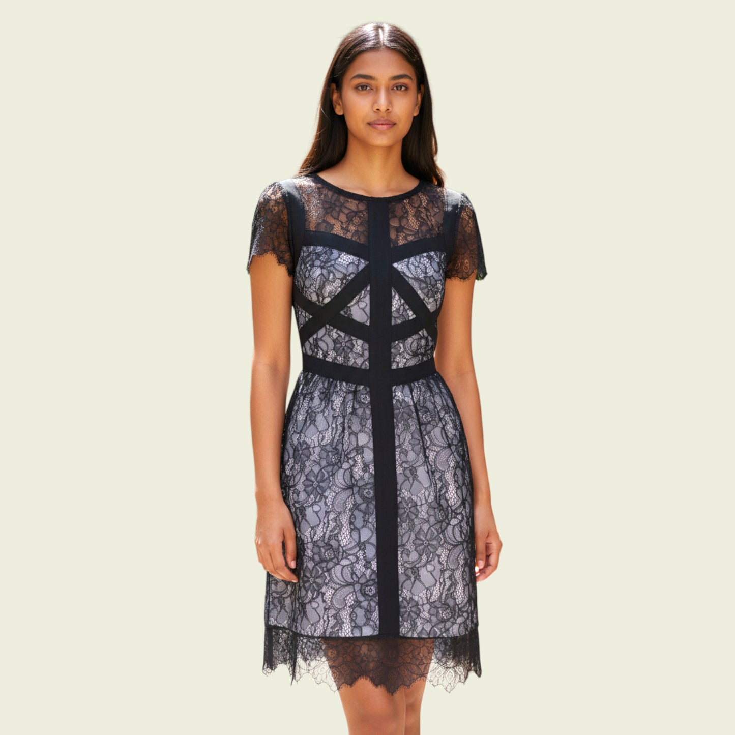 Woman wearing a black lace dress on a beige background